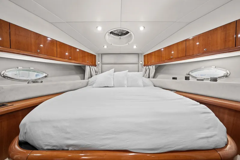  Yacht Photos Pics Luxurious cabin interior of 2006 Sunseeker Manhattan 50 yacht with elegant wood finishes.