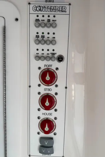  Yacht Photos Pics Control panel of 2024 Contender 28 Tournament boat with labeled switches and dials.