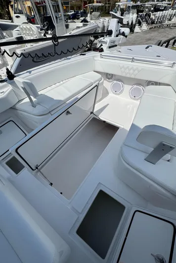  Yacht Photos Pics 2024 Contender 28 Tournament boat interior with seating and storage compartments.