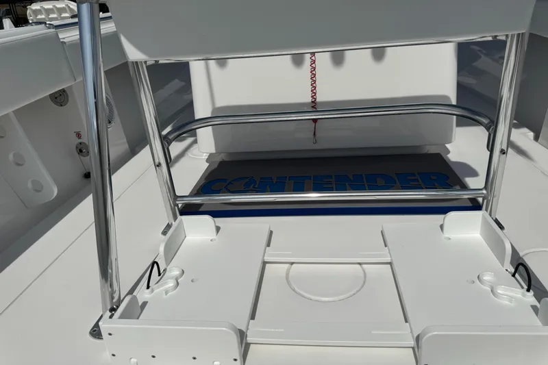  Yacht Photos Pics 2024 Contender 28 Tournament boat deck with seating and storage features.