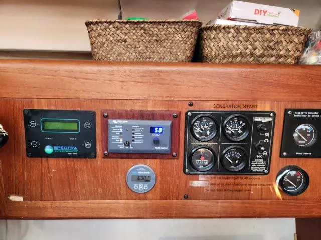 Plan B Yacht Photos Pics Control panel of a 1998 Hunter 450 Passage yacht with various gauges and displays.