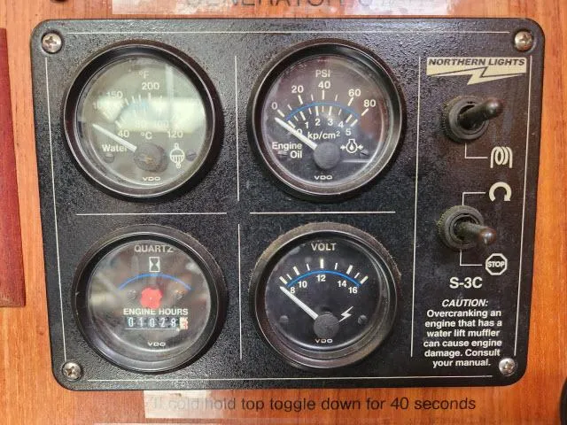Plan B Yacht Photos Pics Control panel of a 1998 Hunter 450 Passage boat with gauges and switches.
