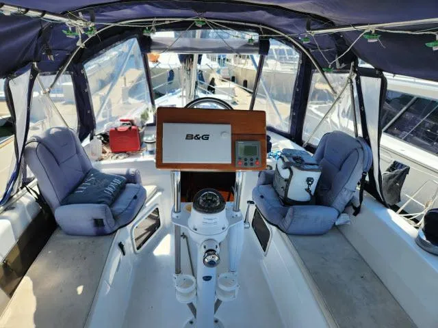 Plan B Yacht Photos Pics Cockpit of 1998 Hunter 450 Passage sailboat with navigation equipment and seating.
