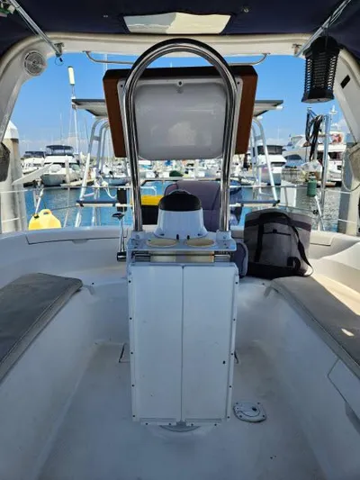 Plan B Yacht Photos Pics 1998 Hunter 450 Passage sailboat cockpit with marina view, featuring navigation equipment and seating.