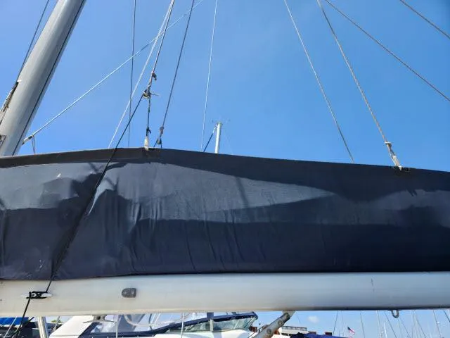 Plan B Yacht Photos Pics Sailboat mast and boom of 1998 Hunter 450 Passage under clear blue sky.