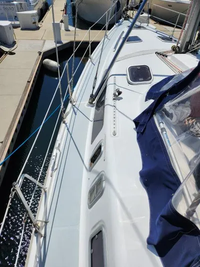 Plan B Yacht Photos Pics 1998 Hunter 450 Passage sailboat docked, showcasing deck and rigging details.