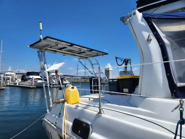 Plan B Yacht Photos Pics Hunter 450 Passage 1998 sailboat docked, featuring solar panels and marine equipment.