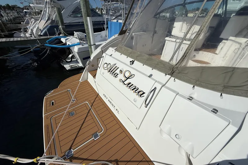  Yacht Photos Pics 2008 Cruisers Yachts 420 Express docked, featuring teak deck and covered seating area.