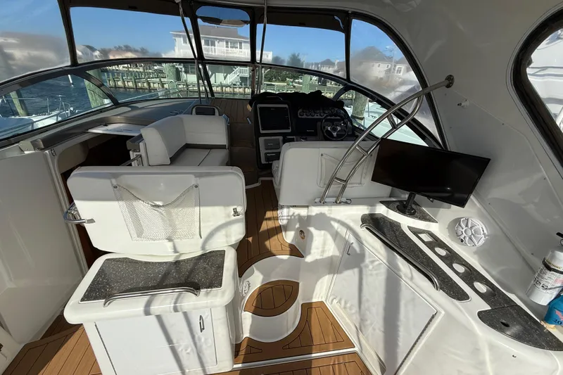  Yacht Photos Pics 2008 Cruisers Yachts 420 Express cockpit with helm, seating, and modern amenities.