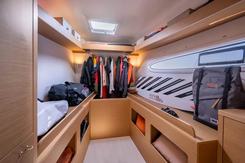  Yacht Photos Pics Manufacturer Provided Image: Luxurious interior of 2026 Excess 14 yacht with modern storage and clothing area.