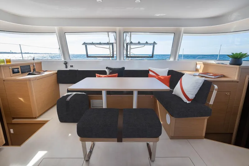  Yacht Photos Pics Manufacturer Provided Image: Luxurious interior of 2026 Excess 14 catamaran with modern seating and ocean view.