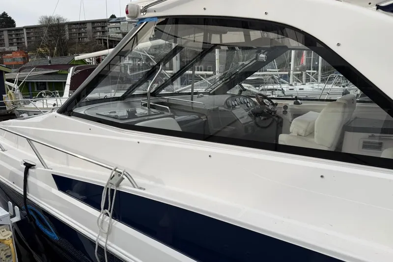 Valubelle Yacht Photos Pics 2012 Regal 35 Sport Coupe yacht docked at marina, showcasing sleek design and luxurious interior.