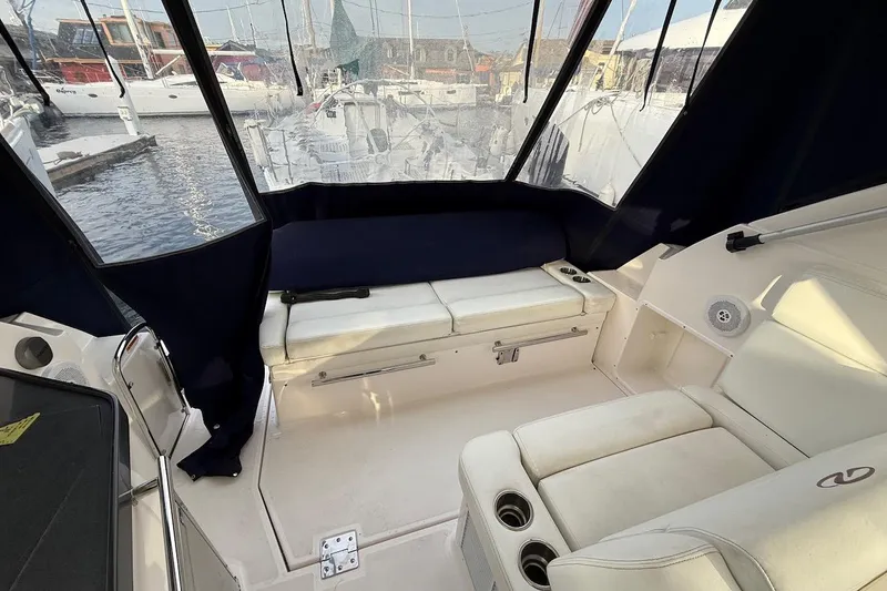 Valubelle Yacht Photos Pics 2012 Regal 35 Sport Coupe interior with white seating and marina view.