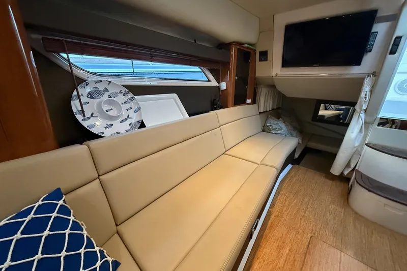 Valubelle Yacht Photos Pics Interior of 2012 Regal 35 Sport Coupe with beige seating and modern decor.