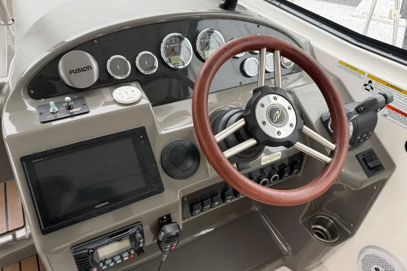 Valubelle Yacht Photos Pics 2012 Regal 35 Sport Coupe dashboard with wooden steering wheel and modern controls.