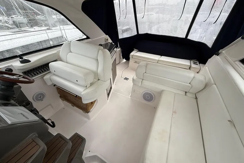 Valubelle Yacht Photos Pics Interior of a 2012 Regal 35 Sport Coupe with white leather seating and helm.