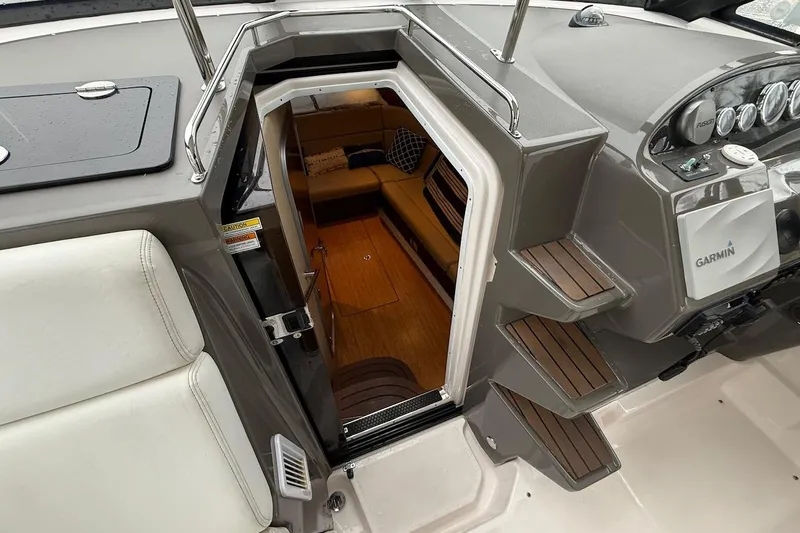 Valubelle Yacht Photos Pics Interior view of 2012 Regal 35 Sport Coupe boat cabin with steps and seating area.
