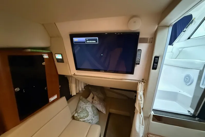 Valubelle Yacht Photos Pics Interior of 2012 Regal 35 Sport Coupe with TV and seating area.