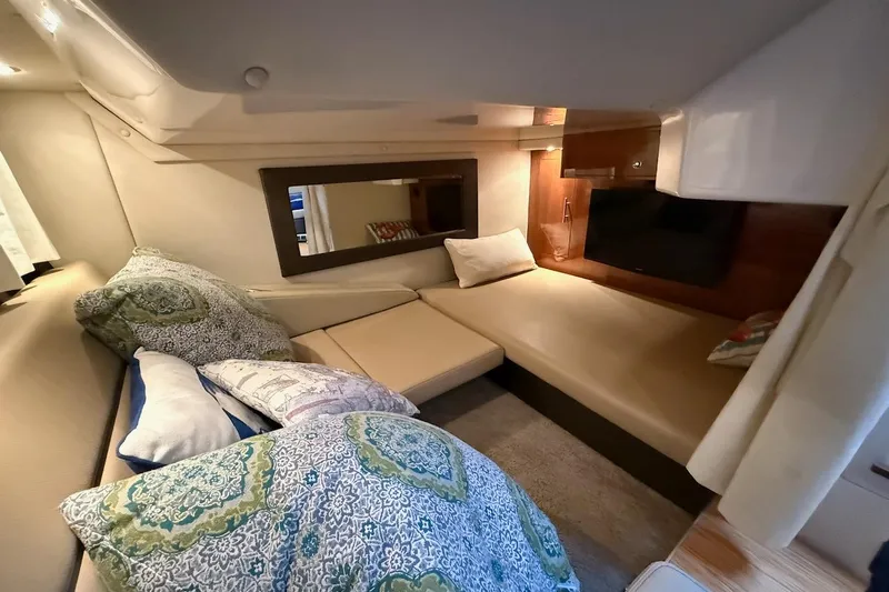 Valubelle Yacht Photos Pics Interior of 2012 Regal 35 Sport Coupe with cozy seating and decorative pillows.