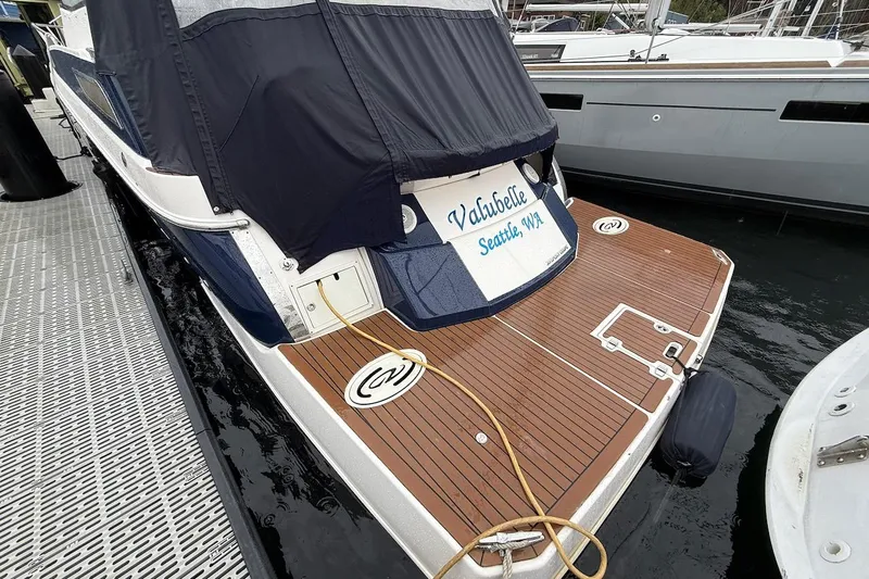 Valubelle Yacht Photos Pics 2012 Regal 35 Sport Coupe docked, featuring teak swim platform and covered cockpit.