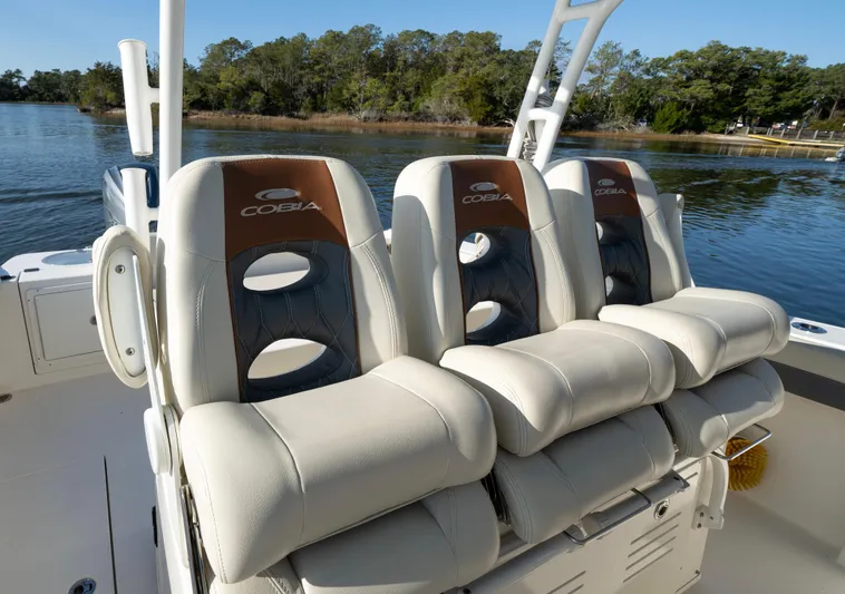Nauti Builder Yacht Photos Pics 2022 Cobia 350 Center Console boat seats, featuring luxurious design and comfort on a serene water backdrop.