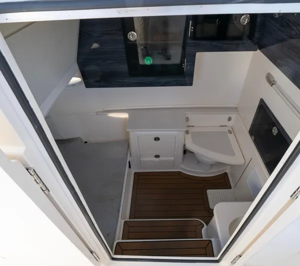 Nauti Builder Yacht Photos Pics Interior of 2022 Cobia 350 Center Console boat, featuring a compact bathroom.