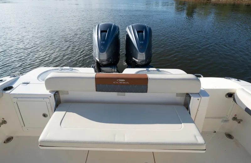 Nauti Builder Yacht Photos Pics 2022 Cobia 350 Center Console boat with twin engines and rear seating on calm water.