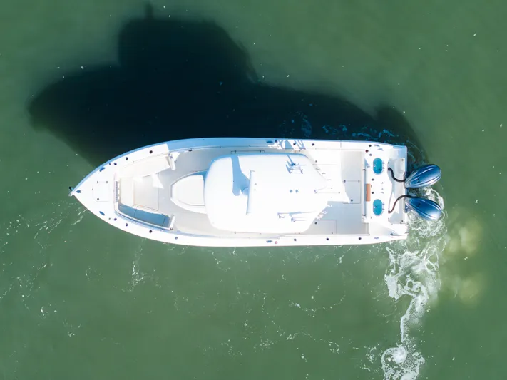 Nauti Builder Yacht Photos Pics Aerial view of 2022 Cobia 350 Center Console boat on green water.