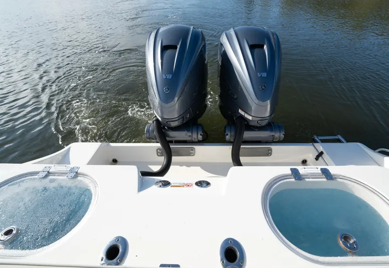 Nauti Builder Yacht Photos Pics 2022 Cobia 350 Center Console with dual outboard engines on calm water.