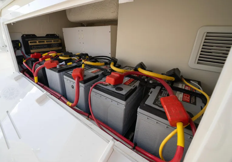 Nauti Builder Yacht Photos Pics 2022 Cobia 350 Center Console boat battery compartment with multiple batteries and wiring.
