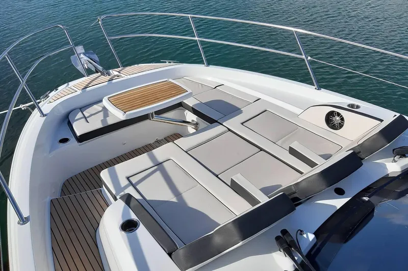  Yacht Photos Pics Manufacturer Provided Image: 2022 Jeanneau Leader 12.5 WA boat deck with seating and table.