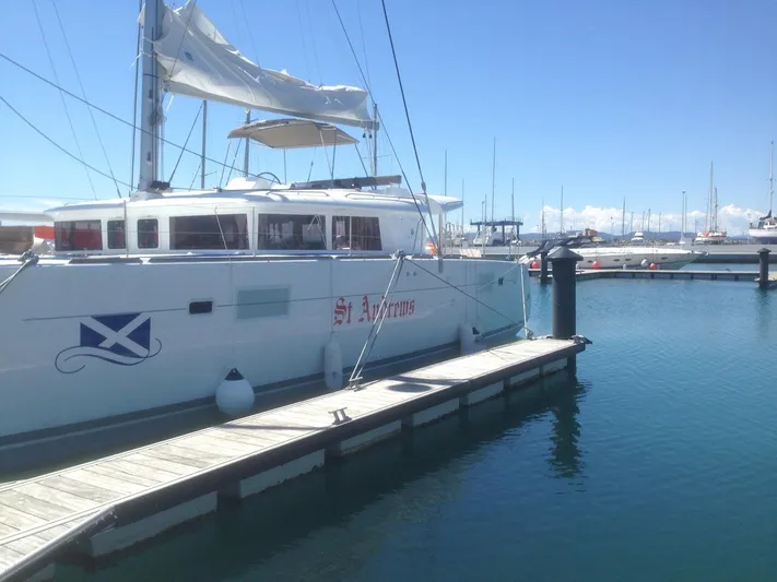  Yacht Photos Pics Lagoon 450 catamaran docked at marina, 2014 model, clear blue sky.