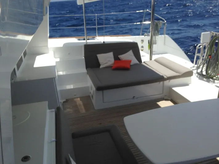  Yacht Photos Pics Spacious deck of 2014 Lagoon 450 catamaran with comfortable seating and ocean view.