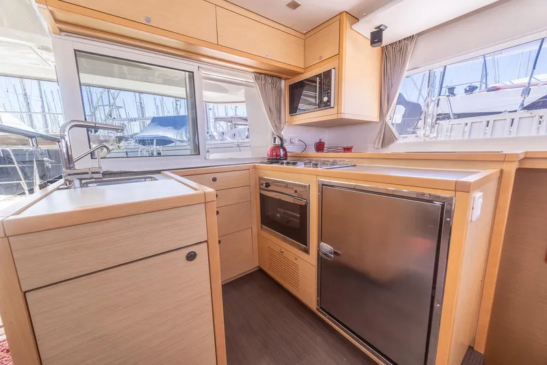  Yacht Photos Pics 2014 Lagoon 450 yacht kitchen with modern appliances and ample natural light.