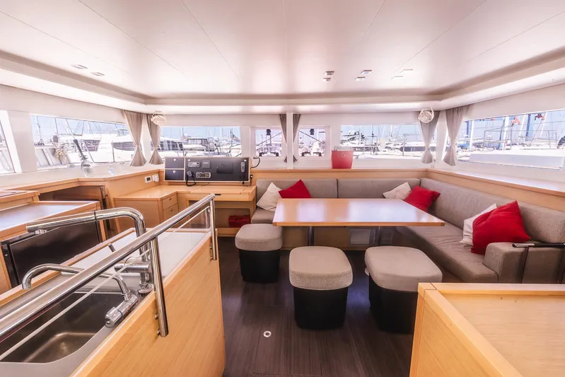  Yacht Photos Pics Spacious interior of 2014 Lagoon 450 catamaran with modern kitchen and cozy seating area.