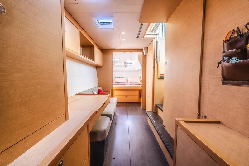  Yacht Photos Pics Interior of 2014 Lagoon 450 yacht, featuring modern wood finish and cozy seating area.