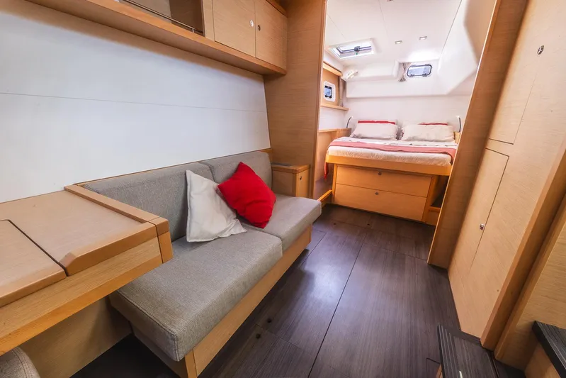  Yacht Photos Pics Interior of 2014 Lagoon 450 yacht with cozy seating and bed area.