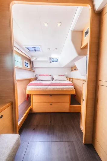  Yacht Photos Pics Luxurious interior cabin of 2014 Lagoon 450 catamaran with cozy bed and modern design.