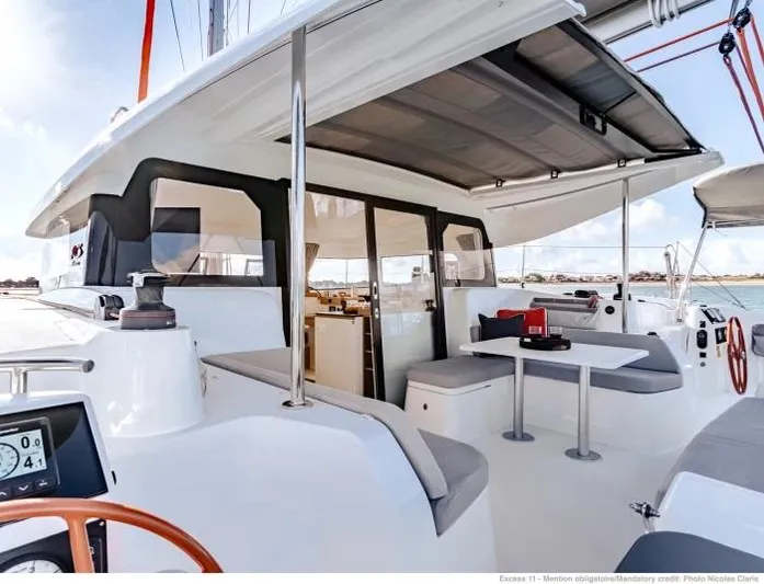  Yacht Photos Pics Manufacturer Provided Image: Excess 11 catamaran 2026 model, featuring spacious outdoor seating and modern design.