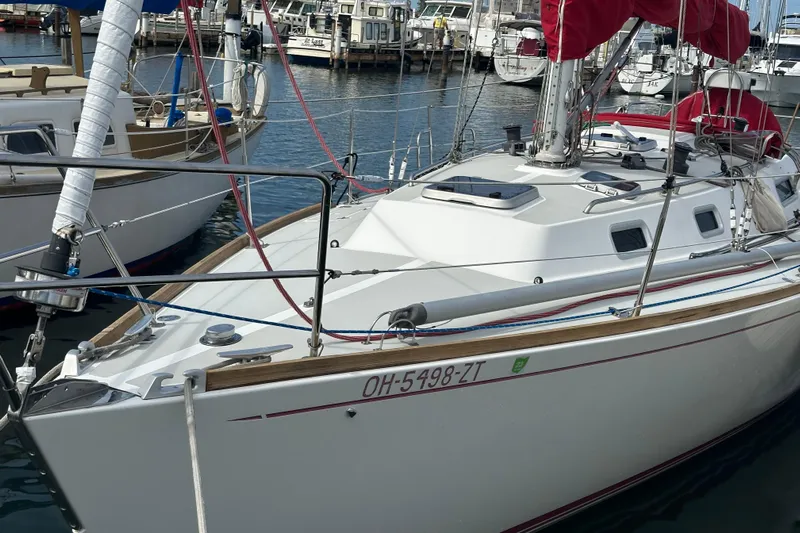 Grand Targee Yacht Photos Pics 1992 J Boats J/35 sailboat docked in marina with red sail covers.