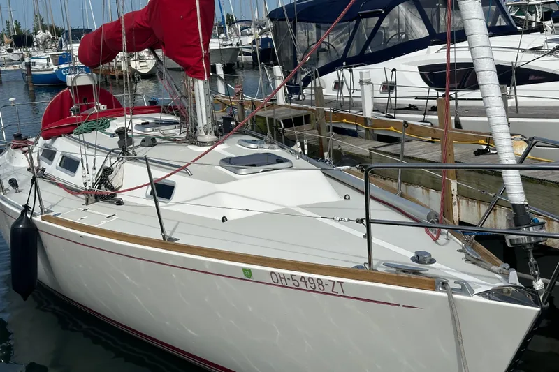 Grand Targee Yacht Photos Pics 1992 J Boats J/35 sailboat docked in marina with red sail covers.