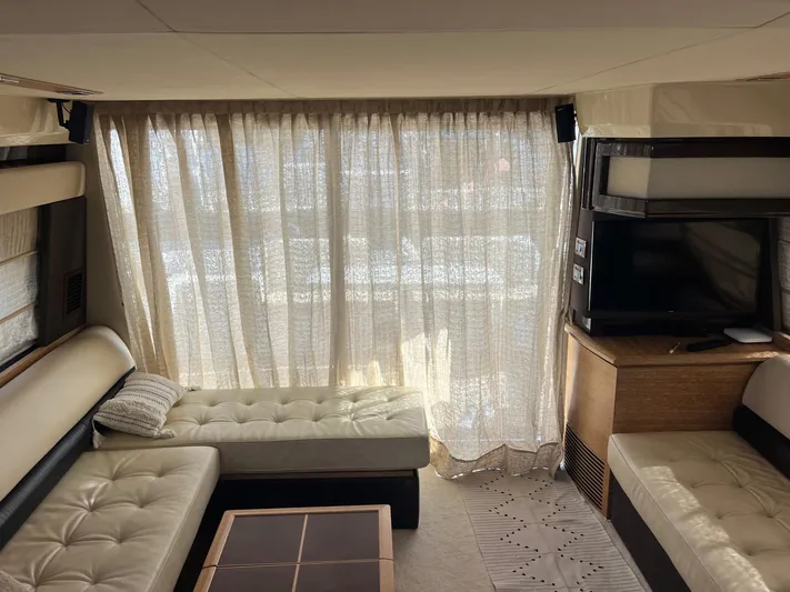  Yacht Photos Pics Luxurious interior of a 2014 Azimut 48 yacht with elegant seating and a TV.