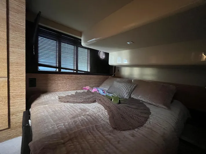  Yacht Photos Pics Luxurious bedroom interior of a 2014 Azimut 48 yacht with cozy bedding.