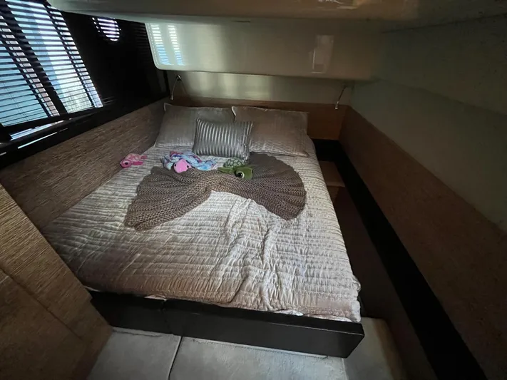  Yacht Photos Pics Cozy bedroom in 2014 Azimut 48 yacht with plush bedding and soft toys.