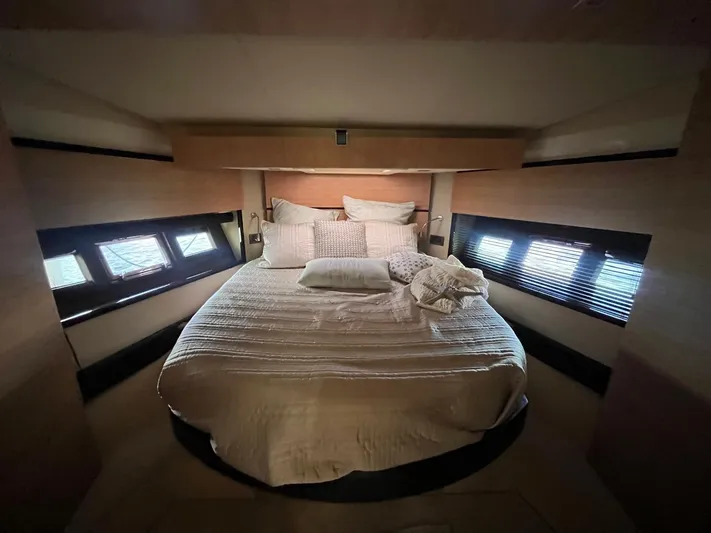  Yacht Photos Pics Luxurious bedroom interior of 2014 Azimut 48 yacht with cozy bedding and natural light.