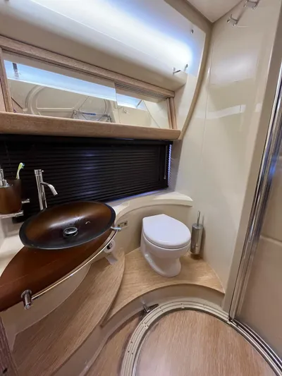  Yacht Photos Pics Luxurious bathroom in 2014 Azimut 48 yacht with modern sink and toilet.