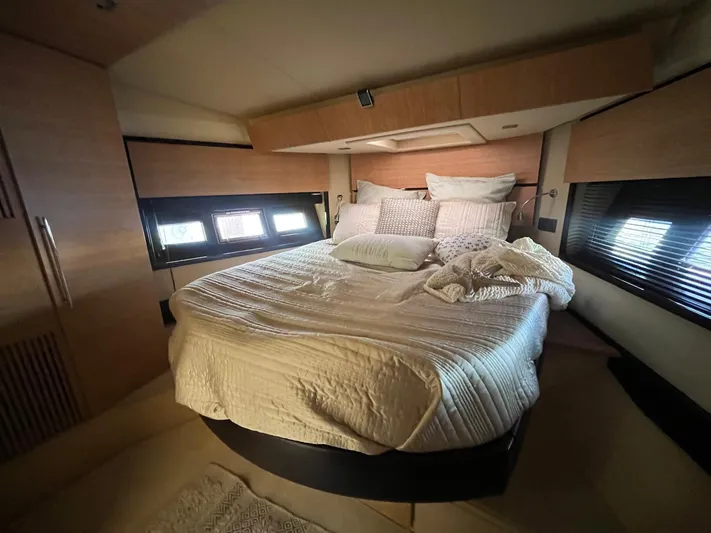  Yacht Photos Pics Luxurious bedroom interior of 2014 Azimut 48 yacht with cozy bedding and modern design.