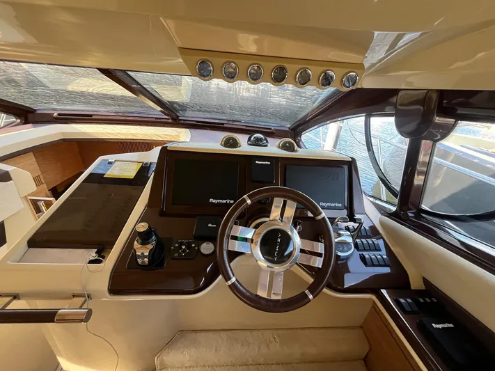  Yacht Photos Pics Luxurious helm of 2014 Azimut 48 yacht with Raymarine navigation system.