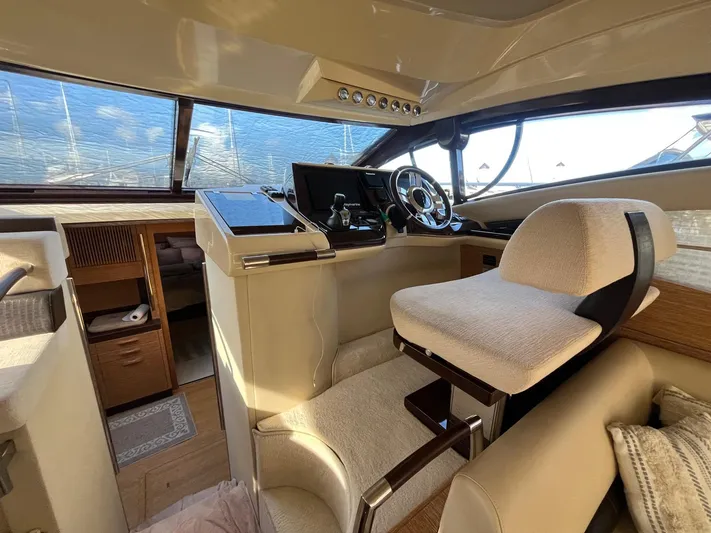  Yacht Photos Pics Luxurious helm of 2014 Azimut 48 yacht with modern controls and plush seating.