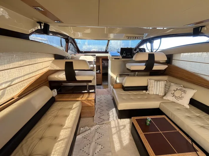 Yacht Photos Pics Luxurious interior of a 2014 Azimut 48 yacht with elegant seating and helm station.